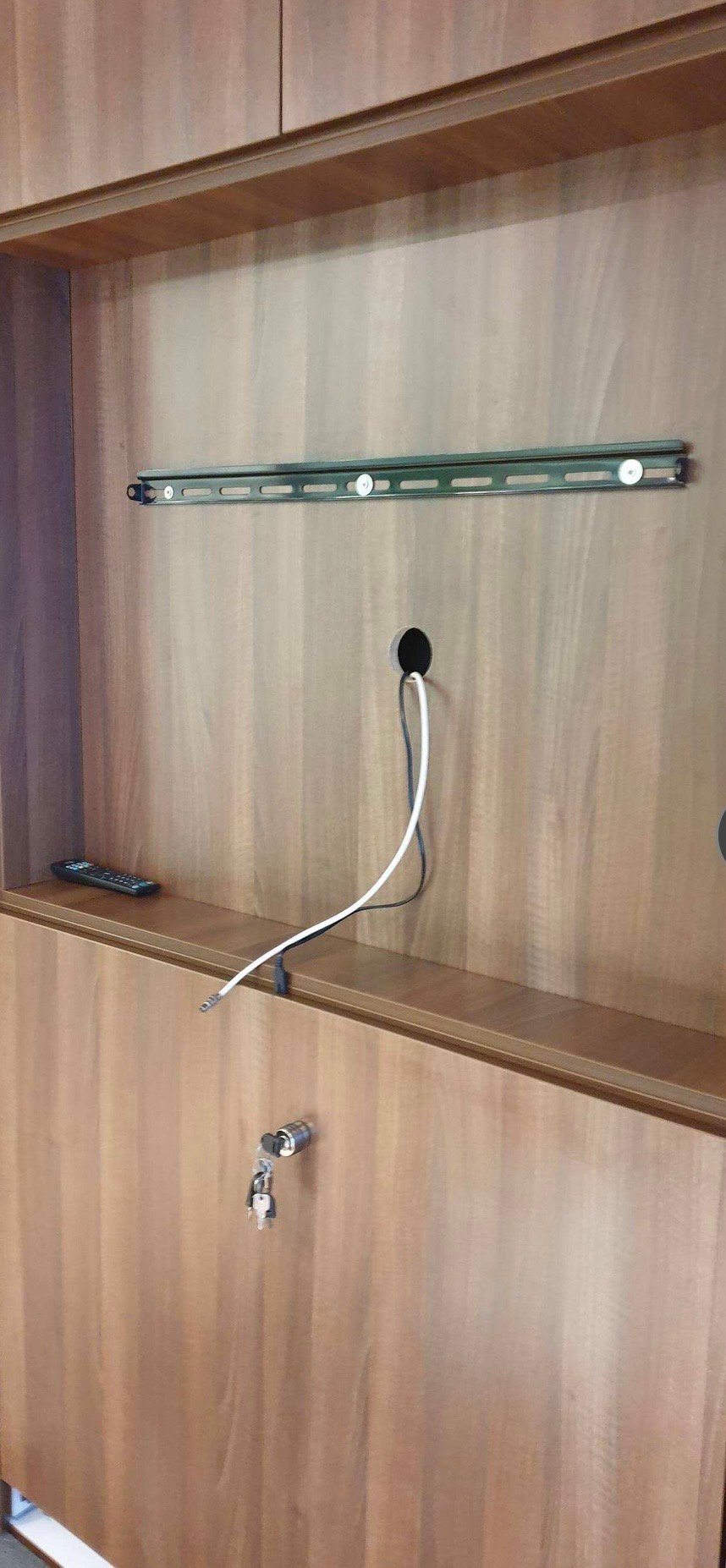 Cable management inside the cupboard housing the boardroom's screen and video-conferencing camera
