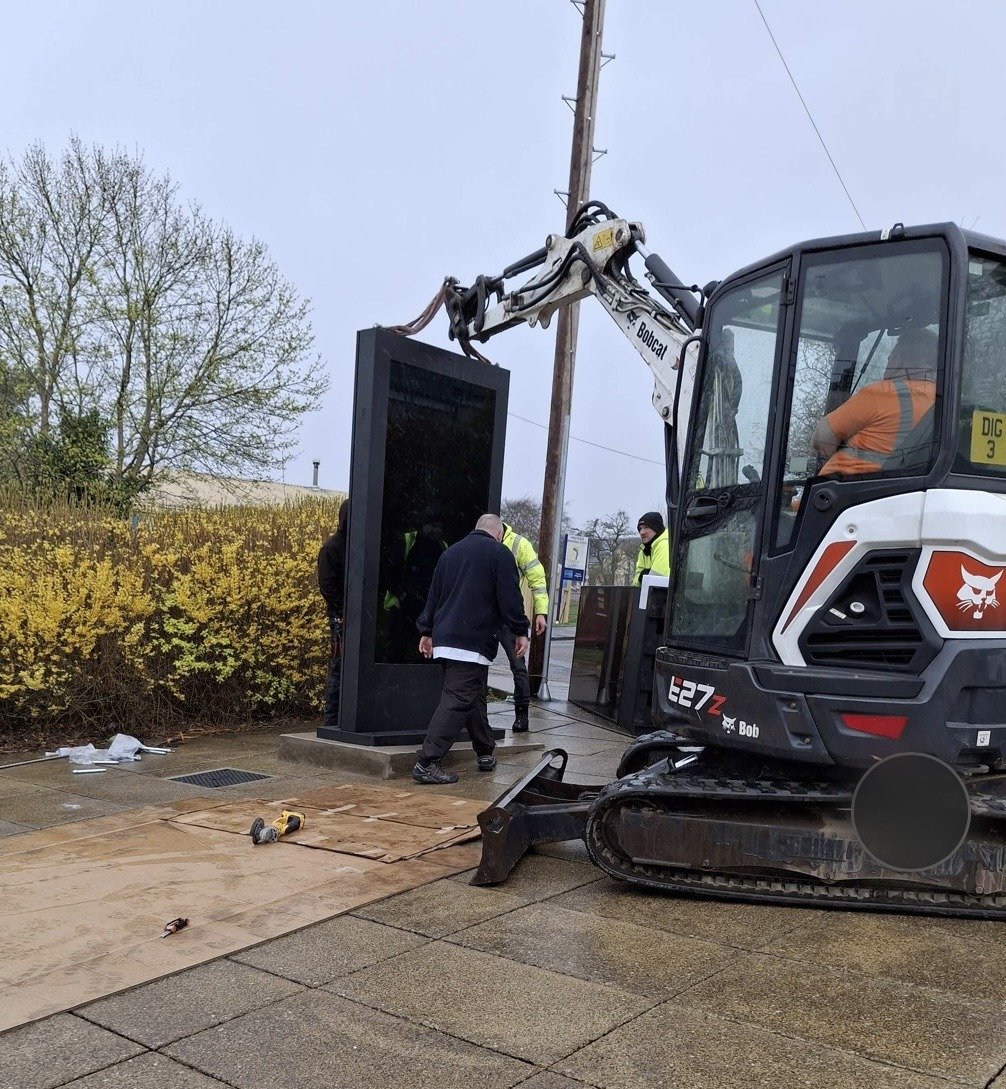 Excavator work during the installation of an outdoor LED screen at Lanark Memorial Hall