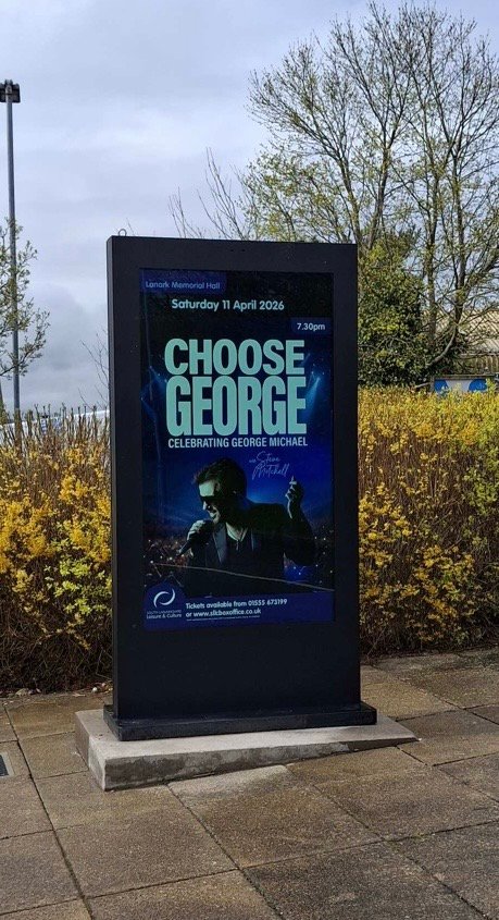 A second outdoor LED totem screen at a different point on the Lanark Memorial Hall site
