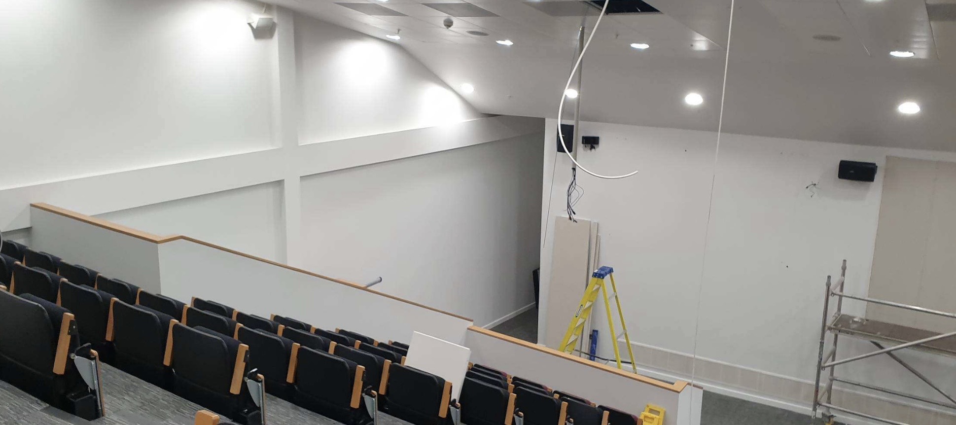 Tiered auditorium seating at the SFRS Cambuslang auditorium, with speaker and video wall installation