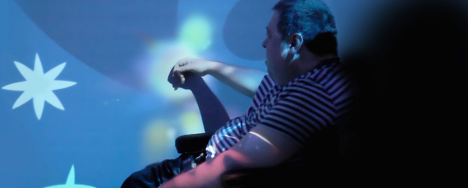 Immersive rooms in care settings - calming projected light and colour effects used to create a structured, low-stimulation environment