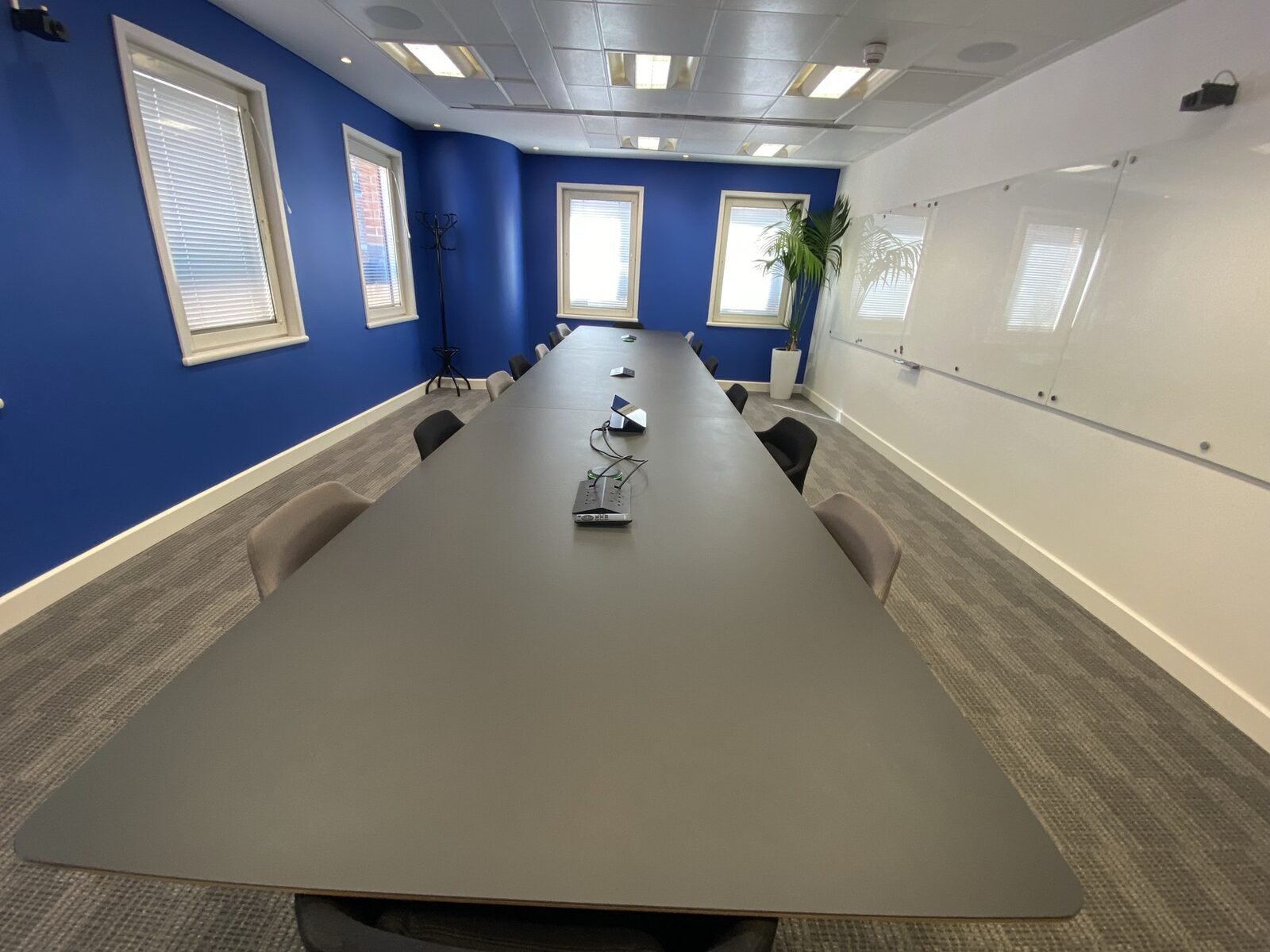 NTT DATA London boardroom - the full length of the room, with camera positions set to cover every seat at the table